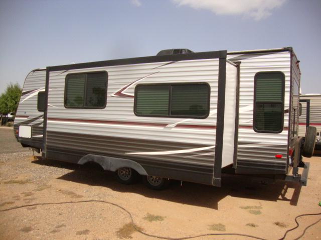 The Pioneer RL250 travel trailer features a sleek and modern exterior design, with aerodynamic contours and durable construction